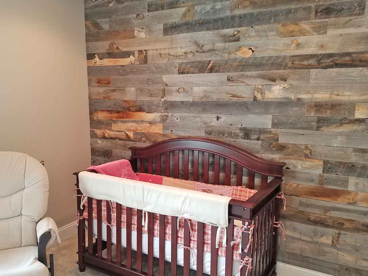 GREENGUARD Gold certified reclaimed wood accent wall in a nursery from Centennial Woods