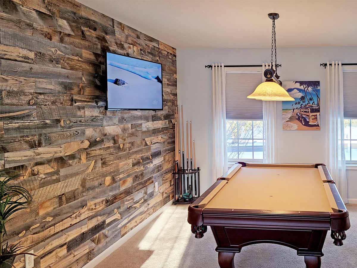 Reclaimed snow fence wood from Centennial Woods in the Cody finish in a billiards room