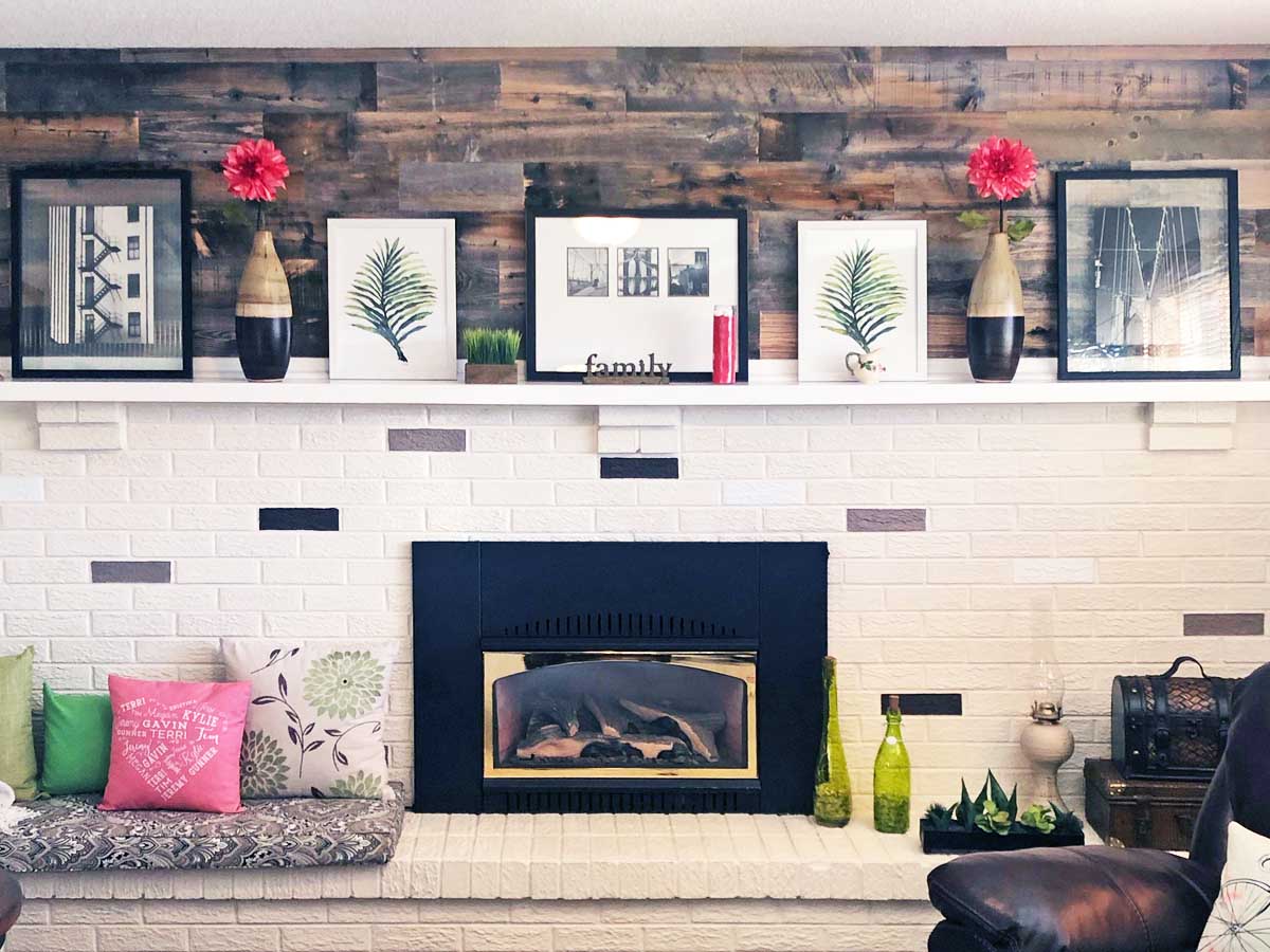 Distressed reclaimed wood above a fireplace